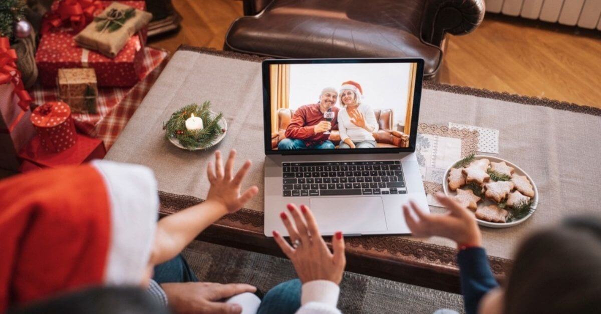 A family video conferences with grandparents for the holidays.