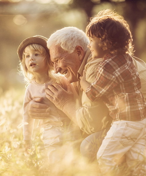 Man playing with a boy and a girl