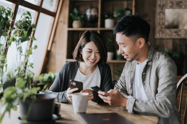 A young couple looking at life insurance options together.