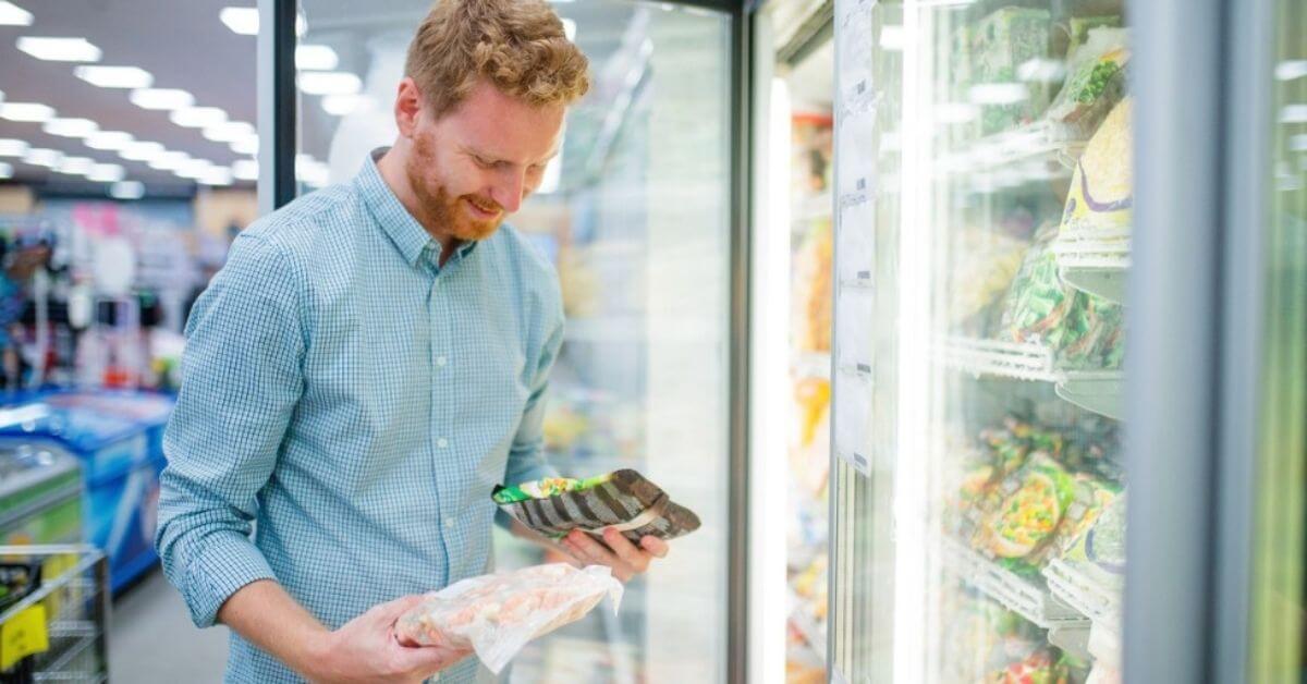 A man compares grocery budgets.