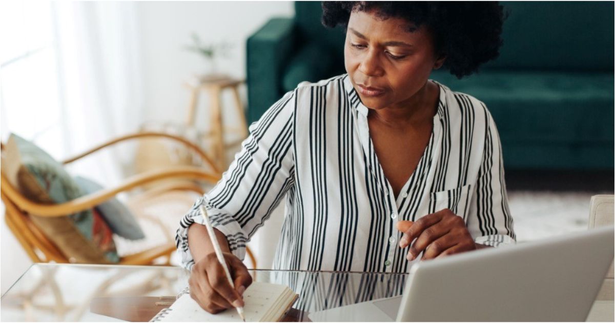 A woman works through her monthly budget.