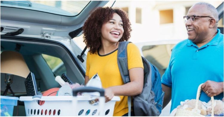 A father helps his daughter back for her move to college.