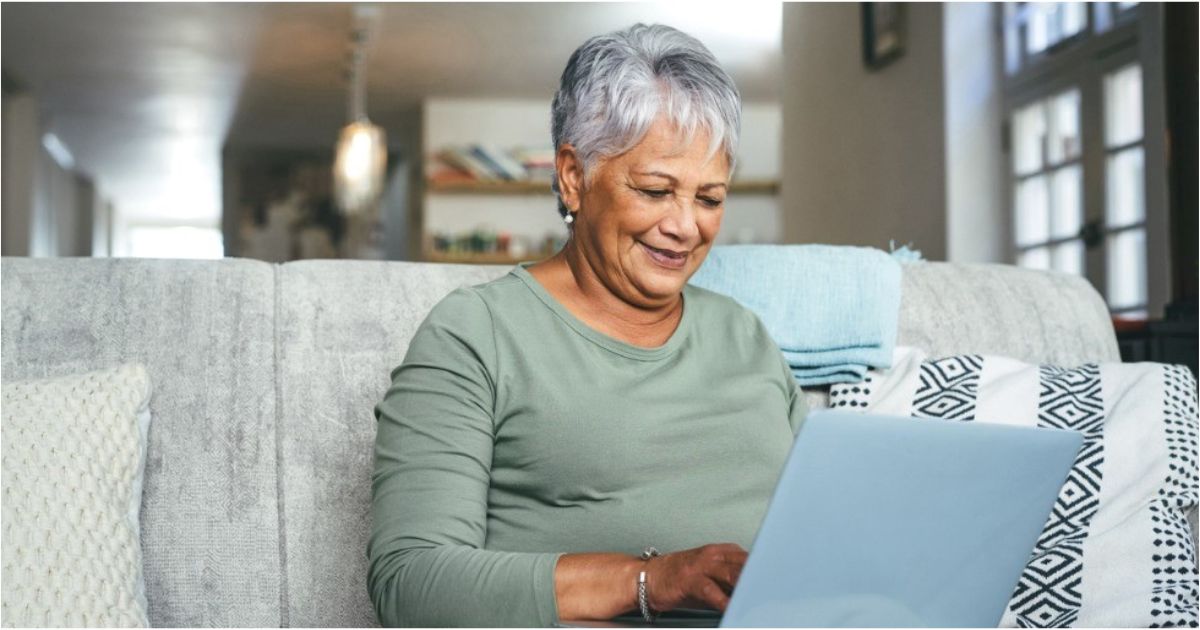 A retireed woman reviews her financial information.