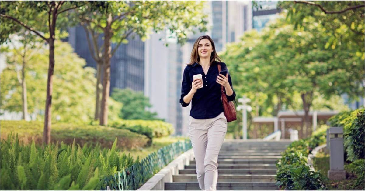 A young woman walks proudly to her new job.