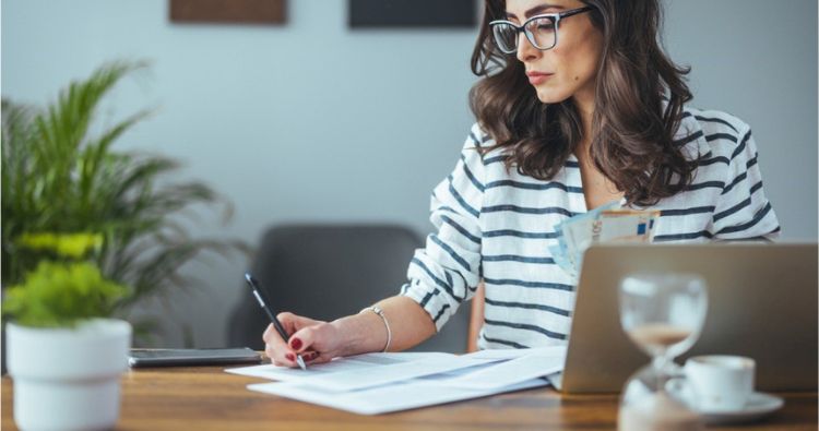 A young woman researching financial tips on her tablet