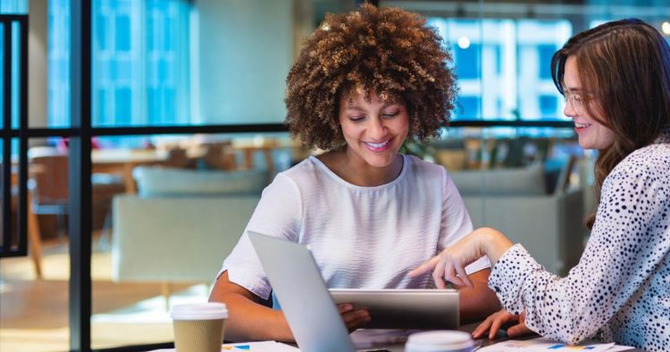 A young woman works with her financial professional.