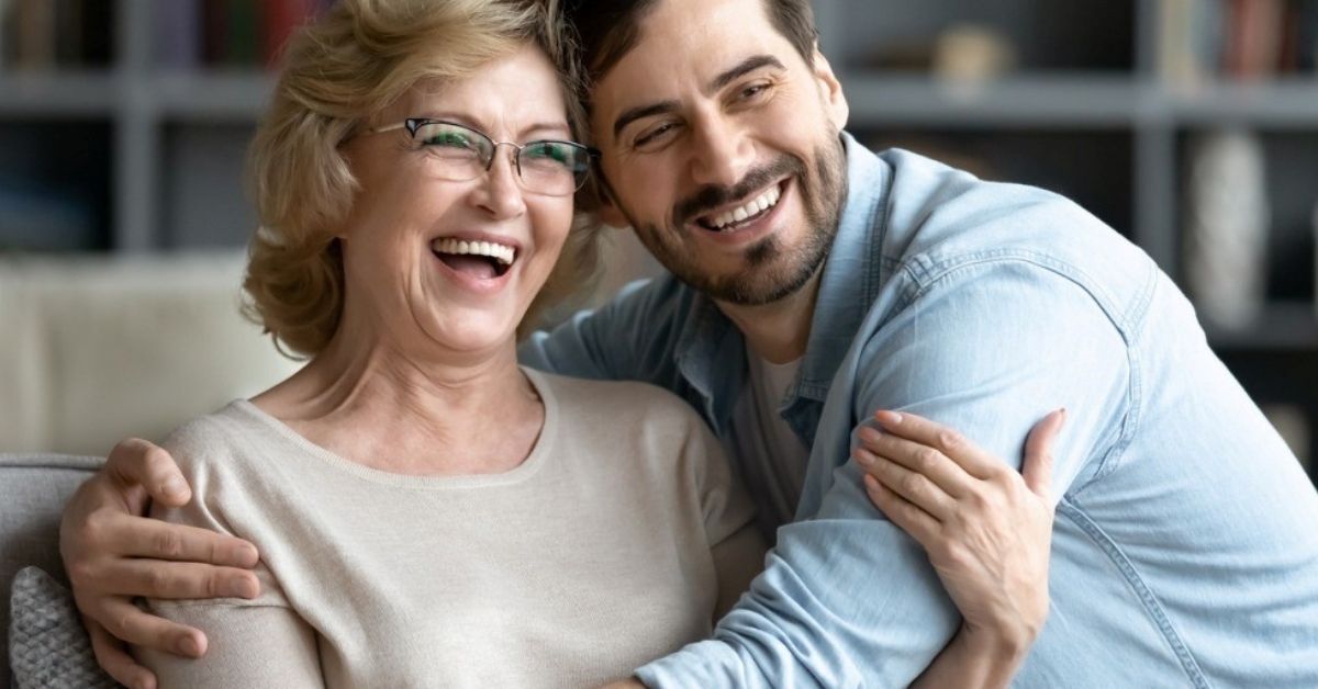 A man hugs his mom.