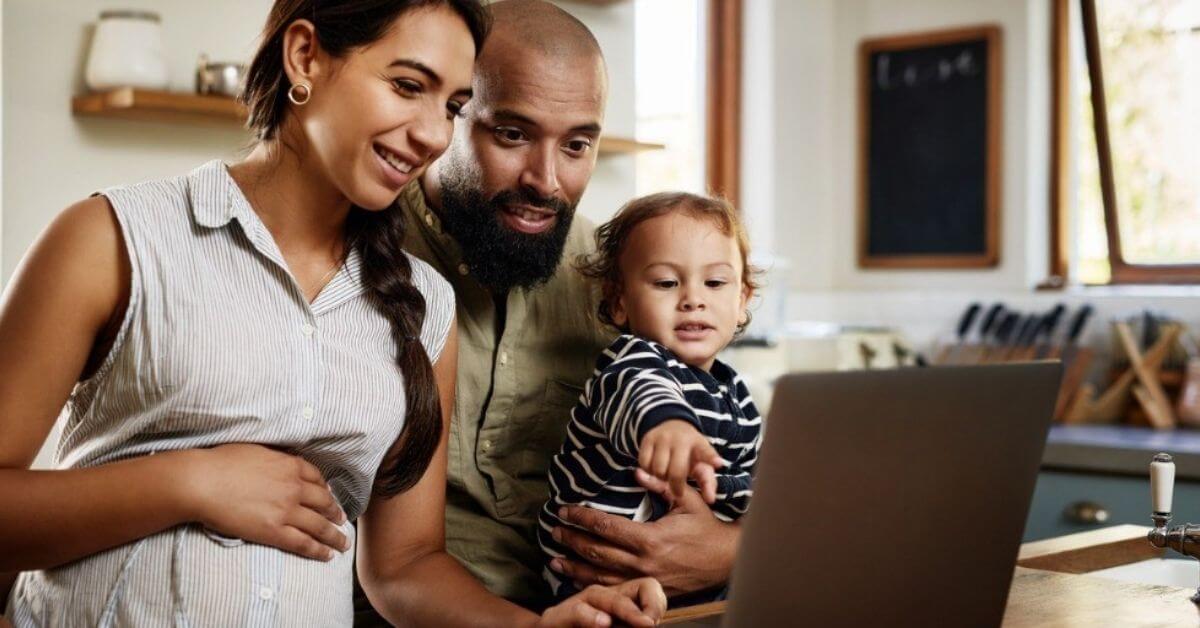 A young family look at life insurance options online