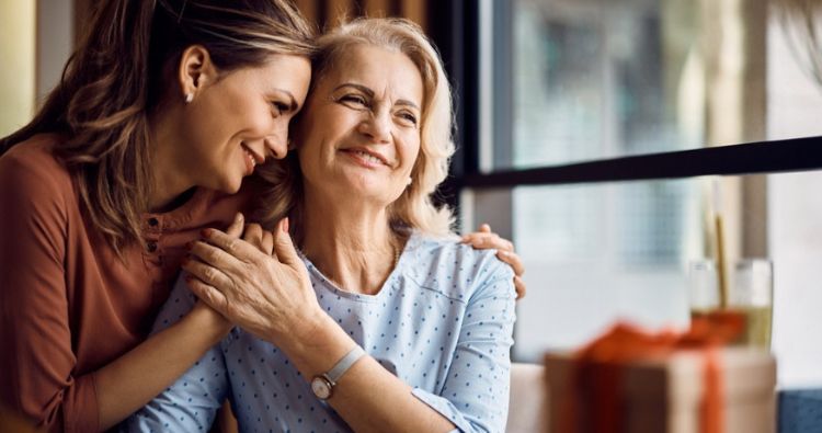 A man hugs his mom.